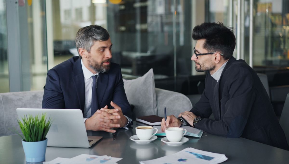 Advisors meeting with a client