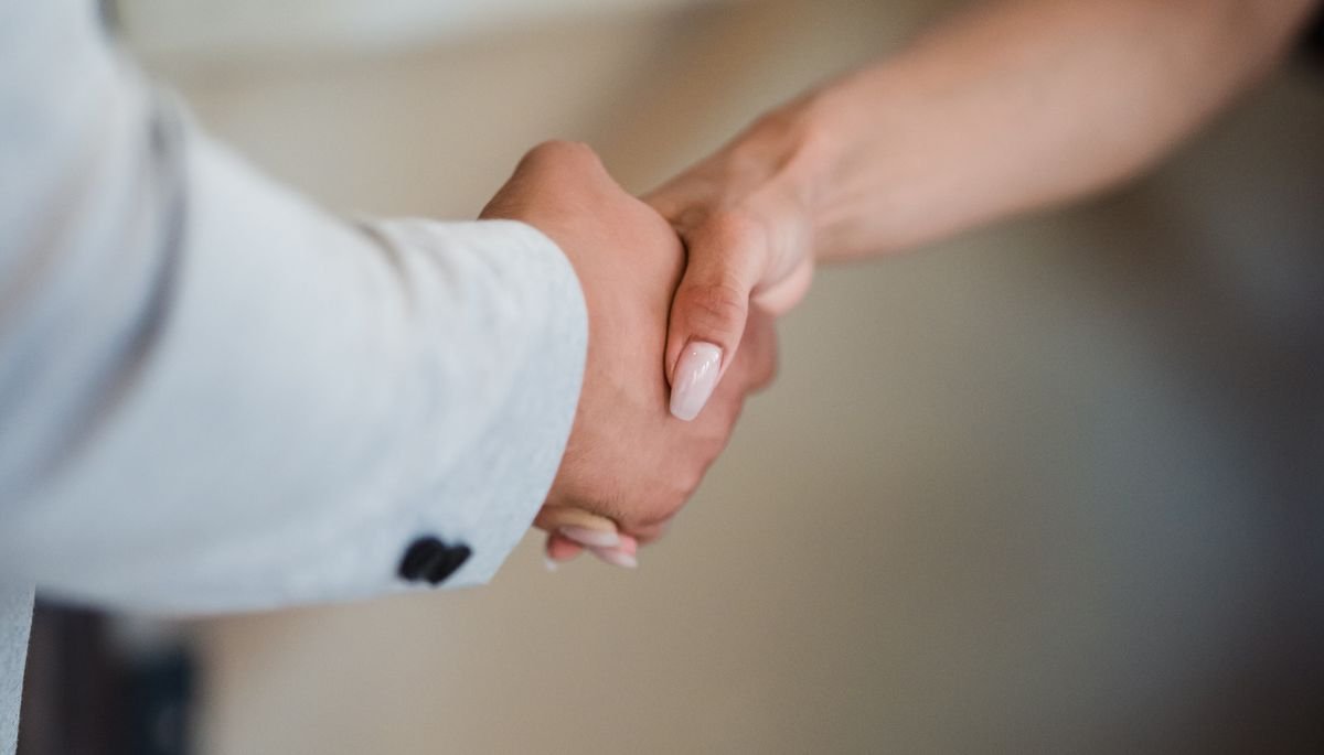 Business agreement handshake