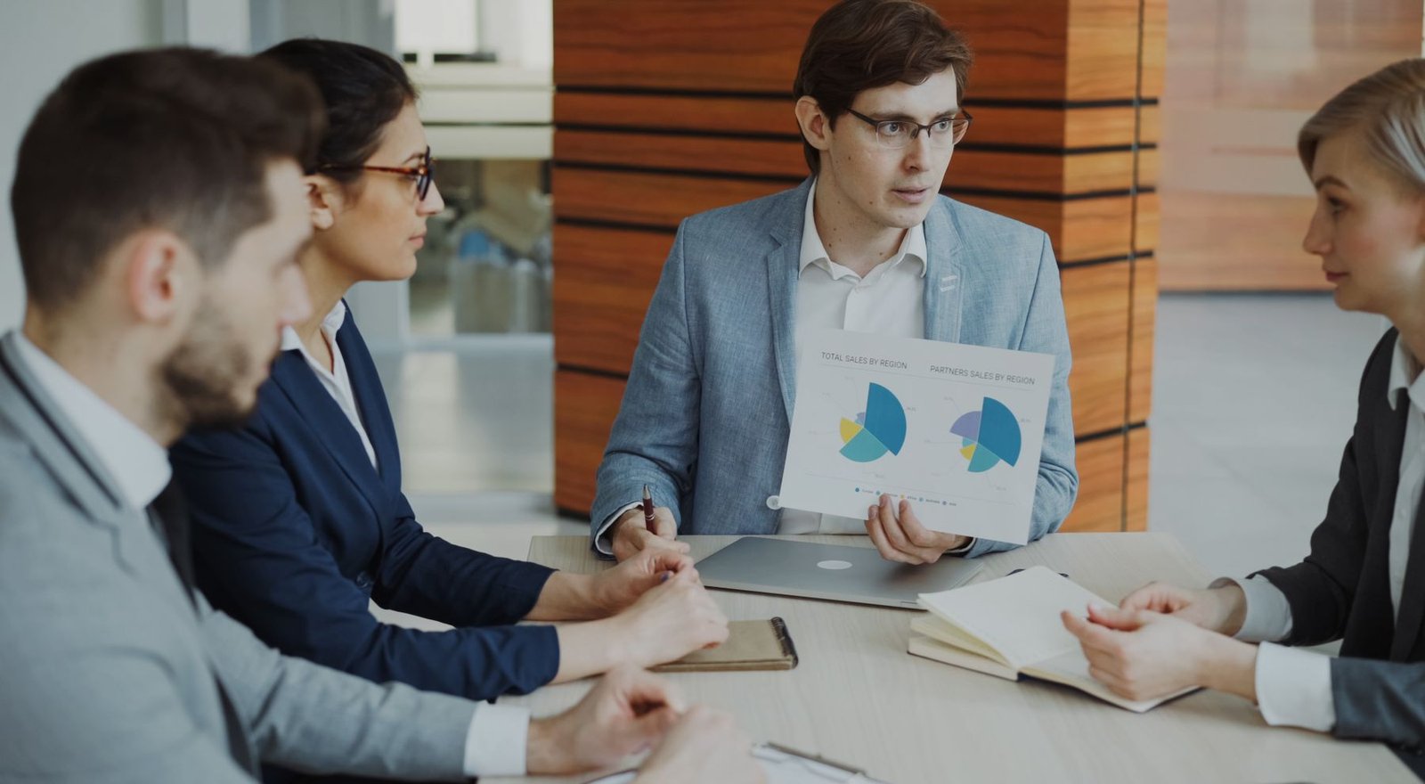 Professionals reviewing financial reports and charts